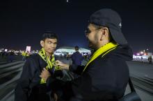 Malaysian supporter who is also visually impaired Muhammad Ridzwan (left) is given a football muffler by his brother Raff Iskandar (right) before the match between Malaysia against Jordan for the Group E stage of the 2023 Asian Cup at Al Janoub Stadium on Jan 16 at 1.30 AM (Malaysian time).