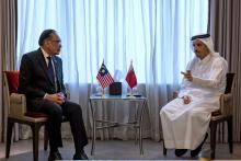 Prime Minister Anwar Ibrahim holds a bilateral discussion with his counterpart from Qatar, Sheikh Mohammed Abdulrahman Al-Thani (right), on the sideline of the World Economic Forum (WEF) Special Meeting, Monday.