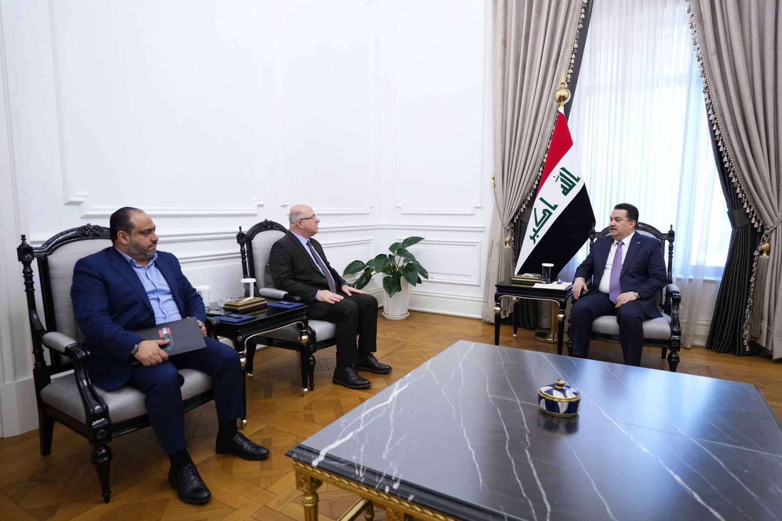 PM, Mohammed Shia Al-Sudani (right), Lebanese Minister of Labor, Mohammad Bahjat Haidar (left)