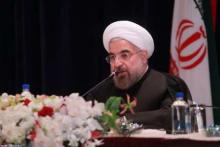  Families of nuclear martyrs accompany President Rouhani in press conference  