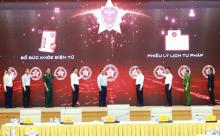 Prime Minister Phạm Minh Chính and other delegates press the buttons to launch the E-health and judicial records provided via VNeID. (Photo: VNA)