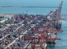 Containers are stacked at a port in South Korea's southern city of Busan on April 3, 2025. (Yonhap)