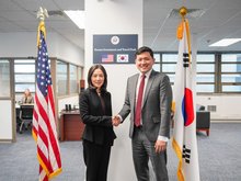 Second Vice Foreign Minister Kim Jina (L) shake hands with acting U.S. Ambassador Kevin Kim at the U.S. Embassy in South Korea in central Seoul on Dec. 5, 2025, in this photo provided by the foreign ministry. (PHOTO NOT FOR SALE) (Yonhap)