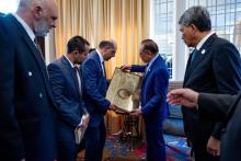  Prime Minister Anwar Ibrahim (second, right) presents a specially printed copy of the Quran, along with a Spanish translation, to the President of the Islamic Association of Peru, Murad Hamida (third, left), during an engagement with the association here on Thursday.