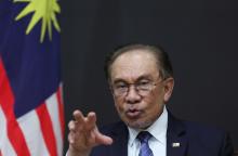 Malaysian Prime Minister Anwar Ibrahim speaking during a press conference after concluding his three-day official visit to South Korea.