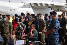 Injured Palestinians landed safely at the Royal Malaysian Air Force base in Subang here at about 2 pm Friday.