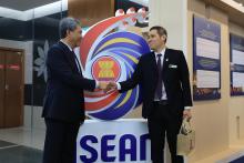 Malaysian  Foreign Minister Mohamad Hasan and Muhamad Khalis Syafiq, the winner of the ASEAN logo competition held earlier this year.