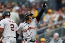 In this Getty Images photo, Lee Jung-hoo of the San Francisco Giants (R) celebrates after hitting a solo home run against the San Diego Padres during a Major League Baseball regular season game at Petco Park in San Diego on March 30, 2024. (Yonhap)