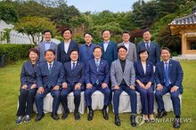 President Lee Jae-myung (C, front) and the leadership of the Democratic Party pose for a photo at Lee's official residence in Hannam-dong in Seoul on June 7, 2025, in this photo provided by the presidential office. (PHOTO NOT FOR SALE) (Yonhap)