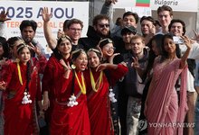 This Nov. 6, 2025, file photo shows foreign students taking part in an international day festival at Ajou University in Suwon, south of Seoul. (Yonhap)