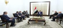 PM, Shia al-Sudani (center) receives a delegation from the World Bank