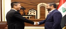 Minister of Higher Education and Scientific Research Naeem Al-Aboudi (right), the Ambassador of China to Baghdad, Cui Wei (left) 