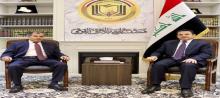 National Security Adviser, Qasim Al-Araji (right), the Ambassador of the State of Kuwait in Baghdad, Hassan Muhammad Zaman (left)