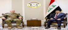 National Security Adviser, Qasim Al-Araji (right), the commander of the international coalition in Iraq and Syria, Major General Kevin Leahy (left) 