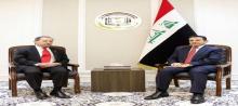 National Security Adviser Qasim al-Araji ( right) , the Chargé d'Affaires of the US Embassy in Baghdad, Ambassador Daniel Rubinstein (left)