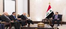PM, Mohammed Shia al-Sudani (right), Palestinian Interior Minister Ziad Mahmoud Mohammed (left)