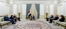 President Abdul Latif Jamal Rashid (center), the President of the American University in Baghdad, Dr. Michael William Mullenx (left) 