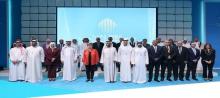 Minister of Finance (third from left) poses for a photo with participants at the 9th Arab Public Finance Forum