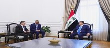 PM, Mohammed Shia Al-Sudani (right), the EU Ambassador to Iraq, Clemens Semtner (left)