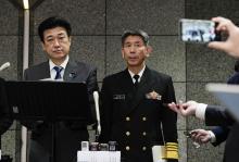 Defense Minister Minoru Kihara (L) holds a press conference at the ministry in Tokyo on April 22, 2024, as Maritime Self-Defense Force Chief of Staff Adm. Ryo Sakai looks on. (Kyodo)