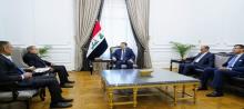 PM, Muhammad al-Sudani (center), Palestinian presidential spokesman Nabil Abu Rudeina (left)