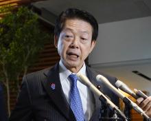 Japanese trade minister Yoji Muto speaks to reporters at the prime minister's office in Tokyo on April 3, 2025. (Kyodo)