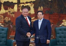 Prime Minister Pham Minh Chinh (R) receives Minister of Foreign Affairs and Cooperation of Timor-Leste Bendito dos Santos Freitas in Hanoi on September 16, 2025. (Photo: VNA)