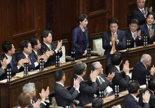 Sanae Takaichi stands up after being reelected Japan's prime minister at the House of Representatives on Feb. 18, 2026. (Kyodo)