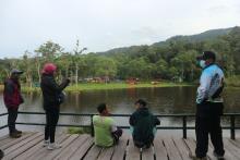 Some people enjoy Tambing Lake at Lore Lindu National Park, Poso District, C Sulawesi Province. (ANTARA/Kristina Natalia)