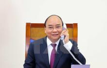 PM Nguyen Xuan Phuc talks on the phone with his Australian counterpart Scott Morrison (Photo: VNA)