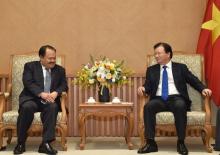  Vietnamese Deputy Prime Minister Trinh Dinh Dung (R) and Lao Minister of Energy and Mines Khammany Inthirath (Source: VNA) 