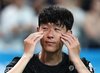 Son Heung-min of Tottenham Hotspur wipes away tears after the end of a preseason match against Newcastle United at Seoul World Cup Stadium in Seoul on Aug. 3, 2025. (Yonhap)