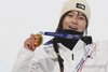 Choi Gaon of South Korea celebrates on the podium after winning the gold medal in the women's halfpipe snowboarding event at the Winter Olympics at Livigno Snow Park in Livigno, Italy, on Feb. 12, 2026. (Yonhap)