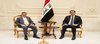 First Deputy Speaker of the Iraqi Parliament, Mohsen Al-Mandalawi, (right), the Chargé d'Affaires of the U.S. Embassy in Iraq, Steven Fagin (left)  